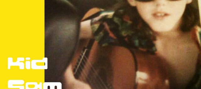 8 year old Sam plays guitar